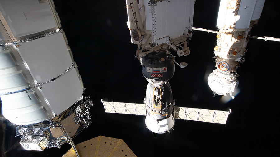 The Soyuz MS-19 crew ship, in between the Cygnus cargo craft and the Prichal module, that will take three Expedition 66 crewmates home is pictured docked to the Rassvet module. It was pictured before the Soyuz MS-21 crew ship docked to Prichal on March 18.