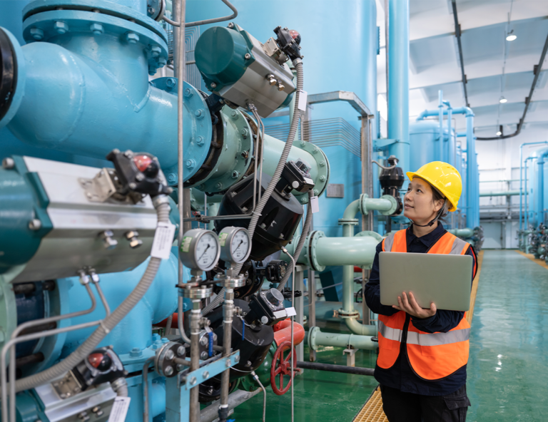 woman-inspecting-machinery