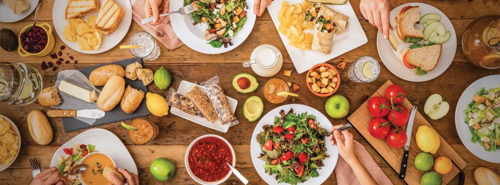 Salad bowls spread across a table