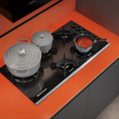 Cooktop preto em uma bancada laranja