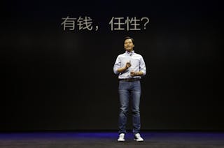 小米 雷軍 有錢就是任性 Lei Jun, founder and Chief Executive Officer of China's mobile company Xiaomi, speaks at the launch ceremony of the