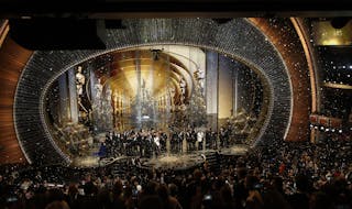 Oscar winners gather on stage after the end of the awards ceremony at the 88th Academy Awards in Hollywood