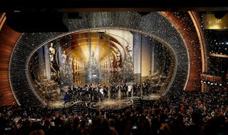 Oscar winners gather on stage after the end of the awards ceremony at the 88th Academy Awards in Hollywood