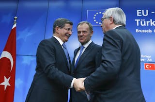 Turkish Prime Minister Ahmet Davutoglu, European Council President Donald Tusk and European Commission President Jean Claude Jun