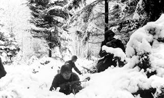 American infantrymen of the 290th Regiment fight in fresh snowfall near Amonines, Belgium