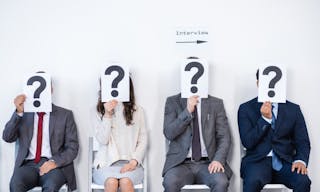 Businesspeople sitting in queue and waiting for interview, holding question marks in office, business concept — Photo by DmitryP