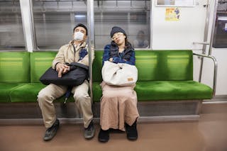 Sleeping Passengers on Subway Train