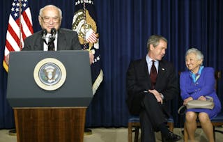 US PRESIDENT GEORGE W BUSH TALKS TO ROSE FRIEDMAN AS HER HUSBAND MILTONSPEAKS.