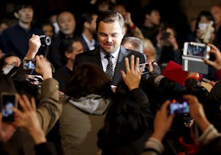 Oscar-winning actor Leonardo DiCaprio signs autographs for fans during the Japan premiere of his movie "The Revenant" in Tokyo, 