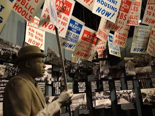 Statue_of_Protester_with_Signage_-_National_Civil_Rights_Museum_-_Downtown_Memphis_-_Tennessee_-_USA