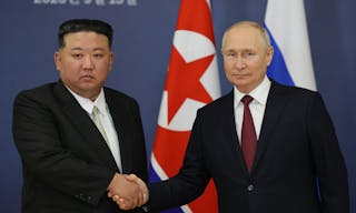 Russian President Vladimir Putin (R) and North Korea's leader Kim Jong Un