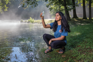 Student by Pond