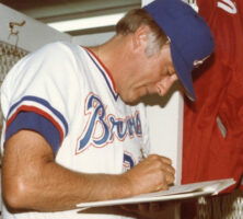 Phil Niekro Signing an Autograph