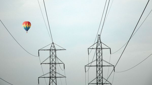 hot air balloons,utility pole,power lines,electricity,transmission tower,line