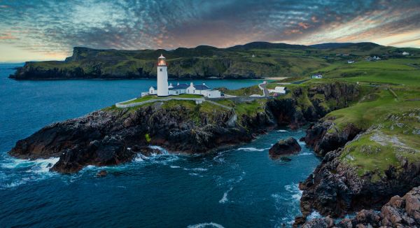 water,cloud,sky,water resources,mountain,lighthouse