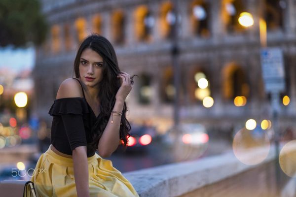 women,women outdoors,long hair,black hair,dark eyes,city lights