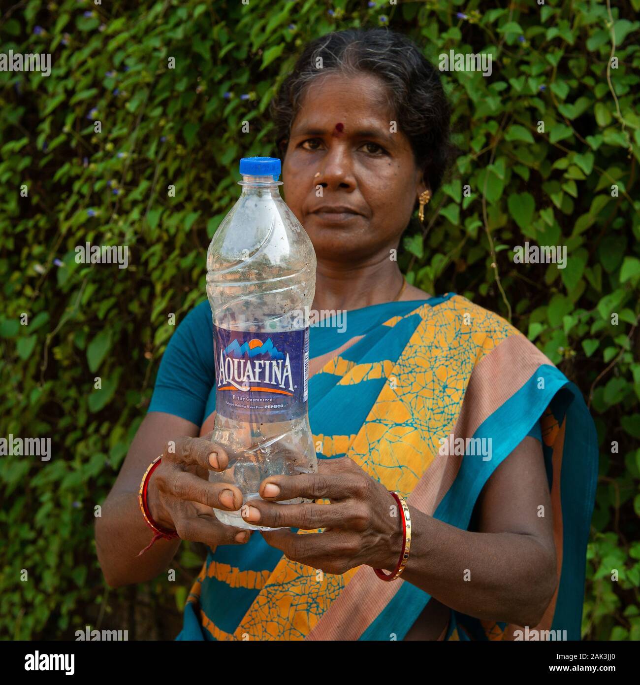 Auroville, India - 21st September 2019: Searching the world's most polluting brand in global audit of plastic waste. Stock Photo