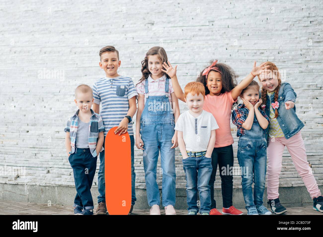 Group of kids looking in the camera posing outdoors. full length. the concept of childhood Stock Photo