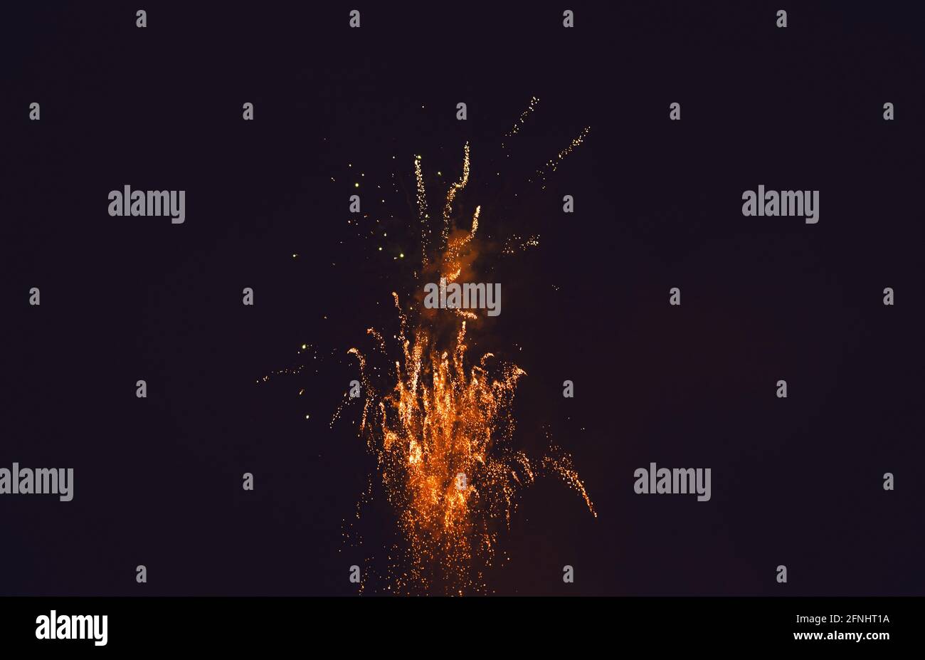 Colorful fireworks. Fireworks are a class of explosive pyrotechnic devices used for aesthetic and entertainment purposes. Stock Photo