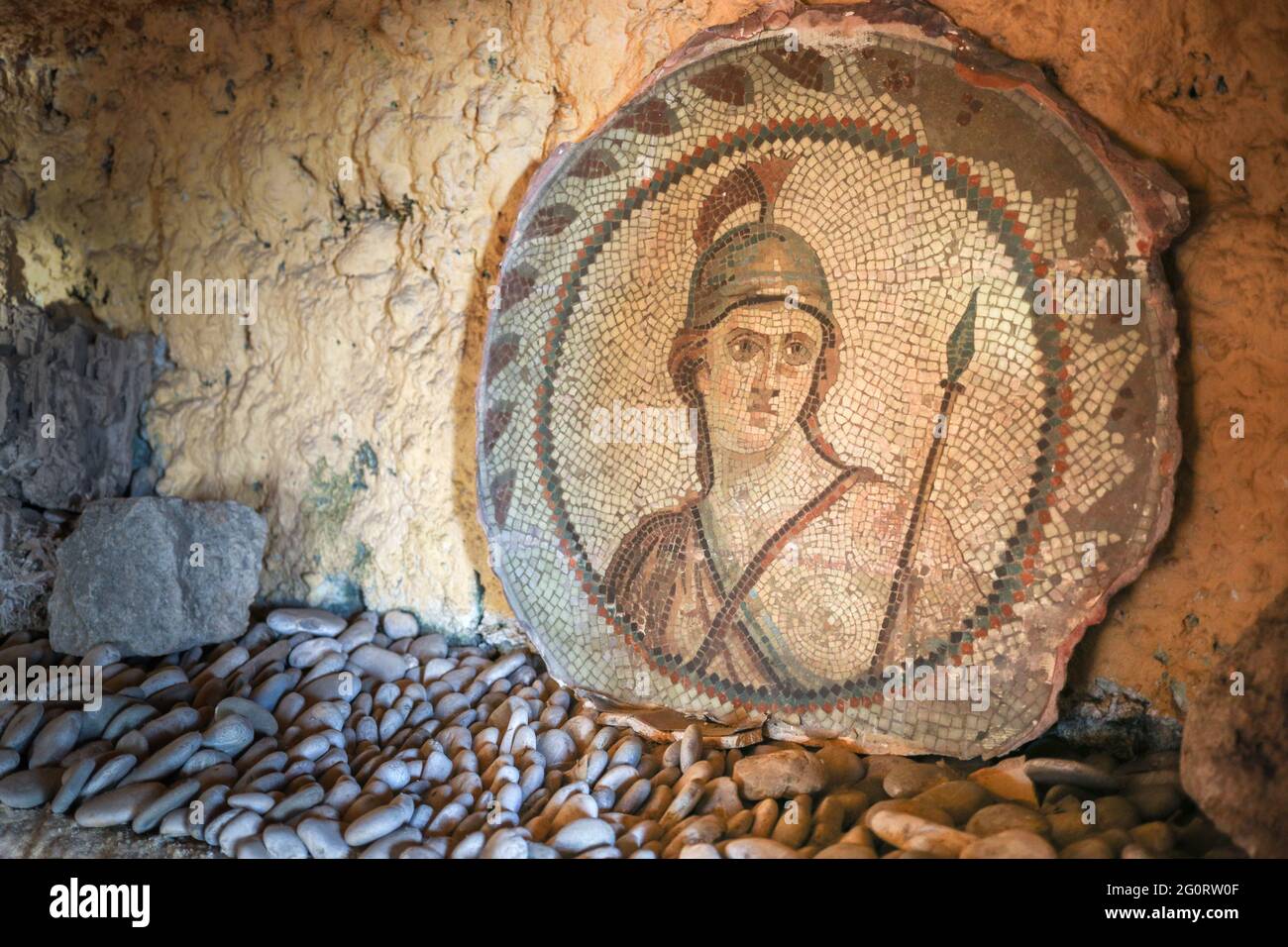 Ancient mosaic depicting a roman soldier, warrior face. Stock Photo