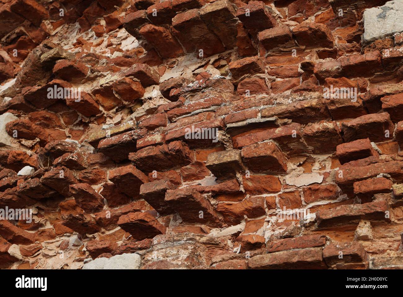 Closeup of the weathered crumbling red brick walls of the historical St. Nicholas Fortress Stock Photo