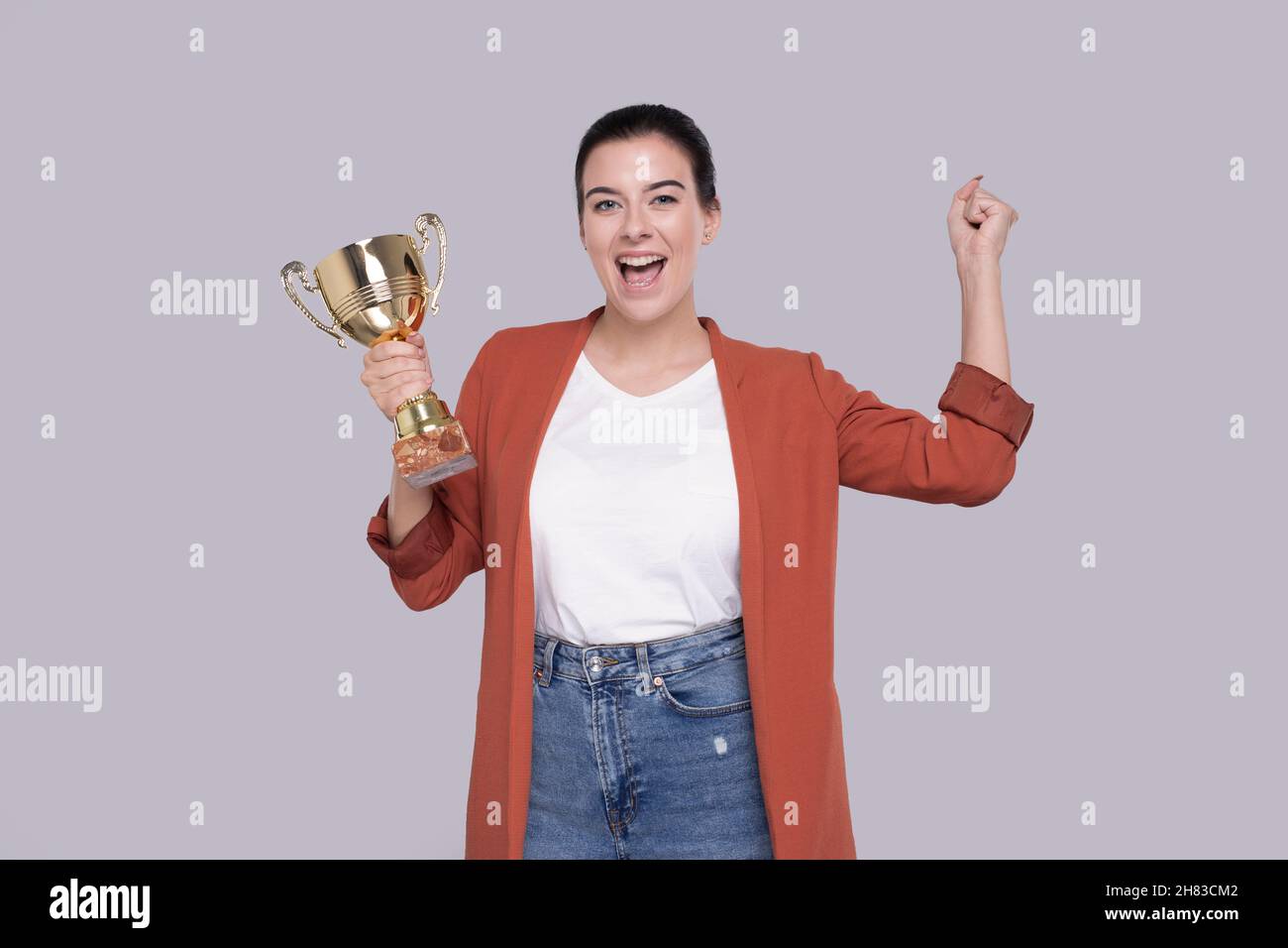 Girl Holding Trophy Happy Isolated. Girl Goals. Winner. Girl Smilling Stock Photo