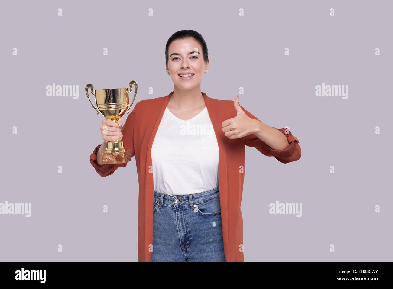 Girl Holding Trophy Showing Thumb Up Happy Isolated. Girl Goals. Winner. Girl Smilling Stock Photo