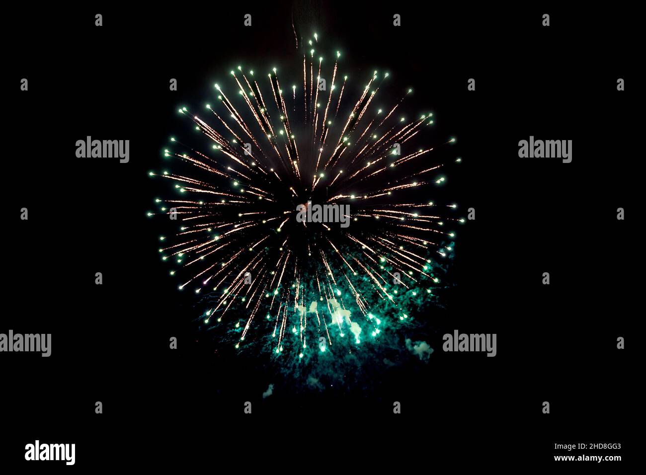 Sparks. Fireworks Are A Class Of Explosive Pyrotechnic Devices Used For Aesthetic Purposes. salute, on a black background. Festive Christmas lighting Stock Photo