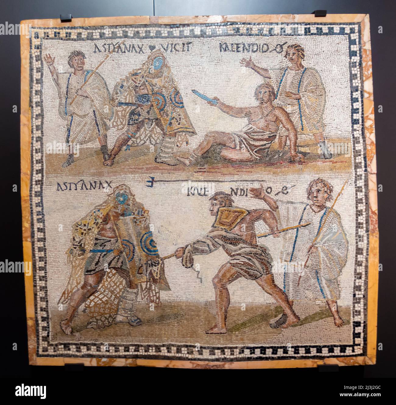 Secutor versus retiarius (a net-fighter) Mosaic on Limestone. 3rd century. Ancient Hispanic-Roman culture. The retiarius Kalendio captures the seculor Stock Photo