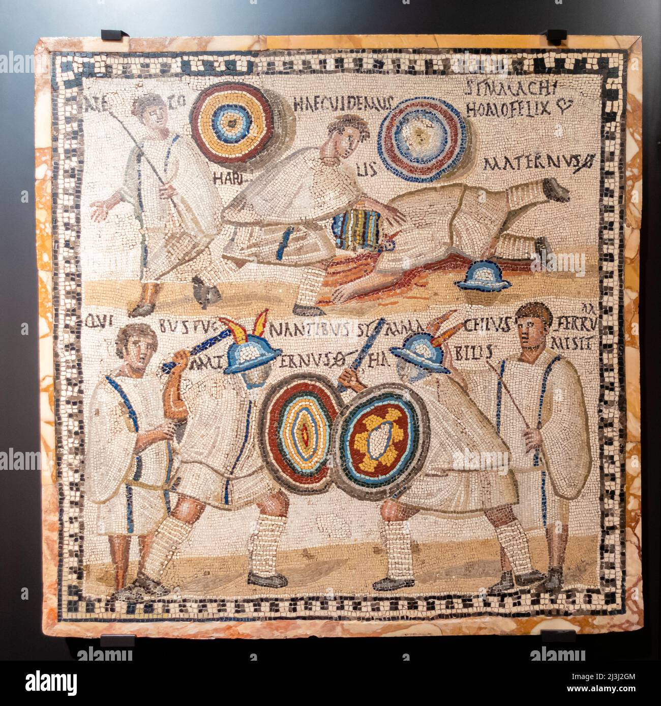 Roman Gladiator fight. Mosaic. Third century. Ancient Rome. Two Eques flanked by two lanistae. National Archaeological Museum, Madrid, Spain Stock Photo