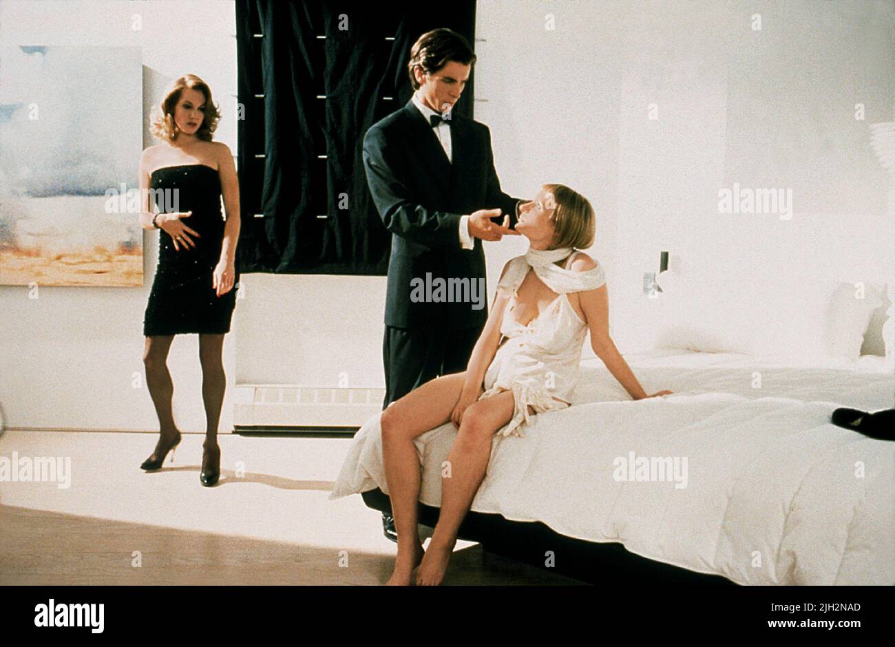 SUTTON,BALE,SEYMORE, AMERICAN PSYCHO, 2000 Stock Photo