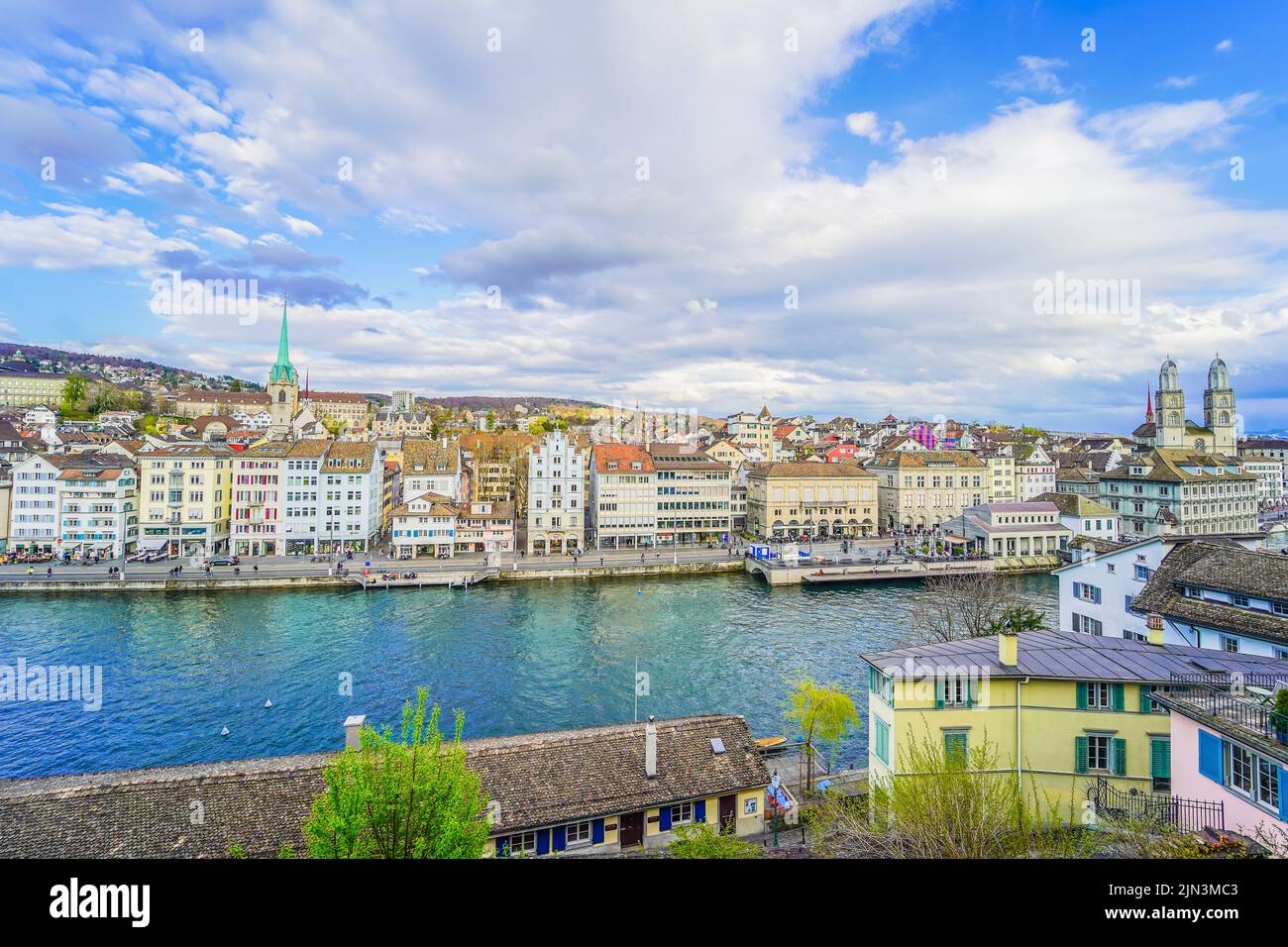 Zurich cityscape during a sunny spring day afternoon with a view of the Limmat river Stock Photo