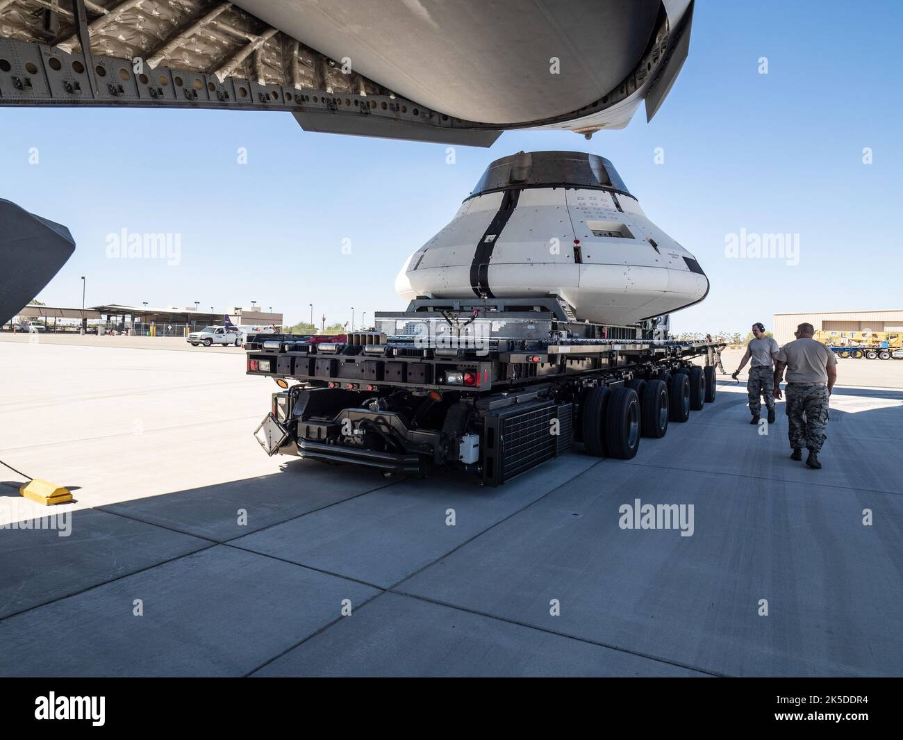 The Orion team prepares the parachute test vehicle for the final drop test which will qualify Orion's parachutes for human flight on Sept. 10, 2018...On September 12, 2018 an Orion test capsule will be dropped from a C-17 aircraft at an altitude of more than six miles to verify the spacecraft’s complex system of 11 parachutes, cannon-like mortars, and pyrotechnic devices work in sequence to slow the capsule’s descent for a safe landing on Earth. Stock Photo