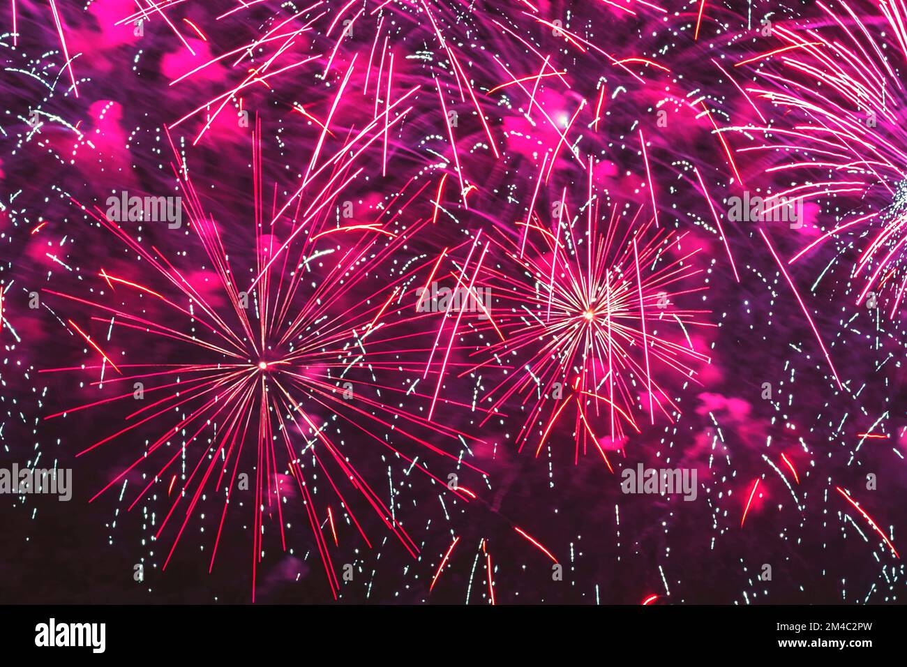 Bright fireworks with sparks. Explosive pyrotechnic devices for aesthetic and entertainment purposes, art Stock Photo