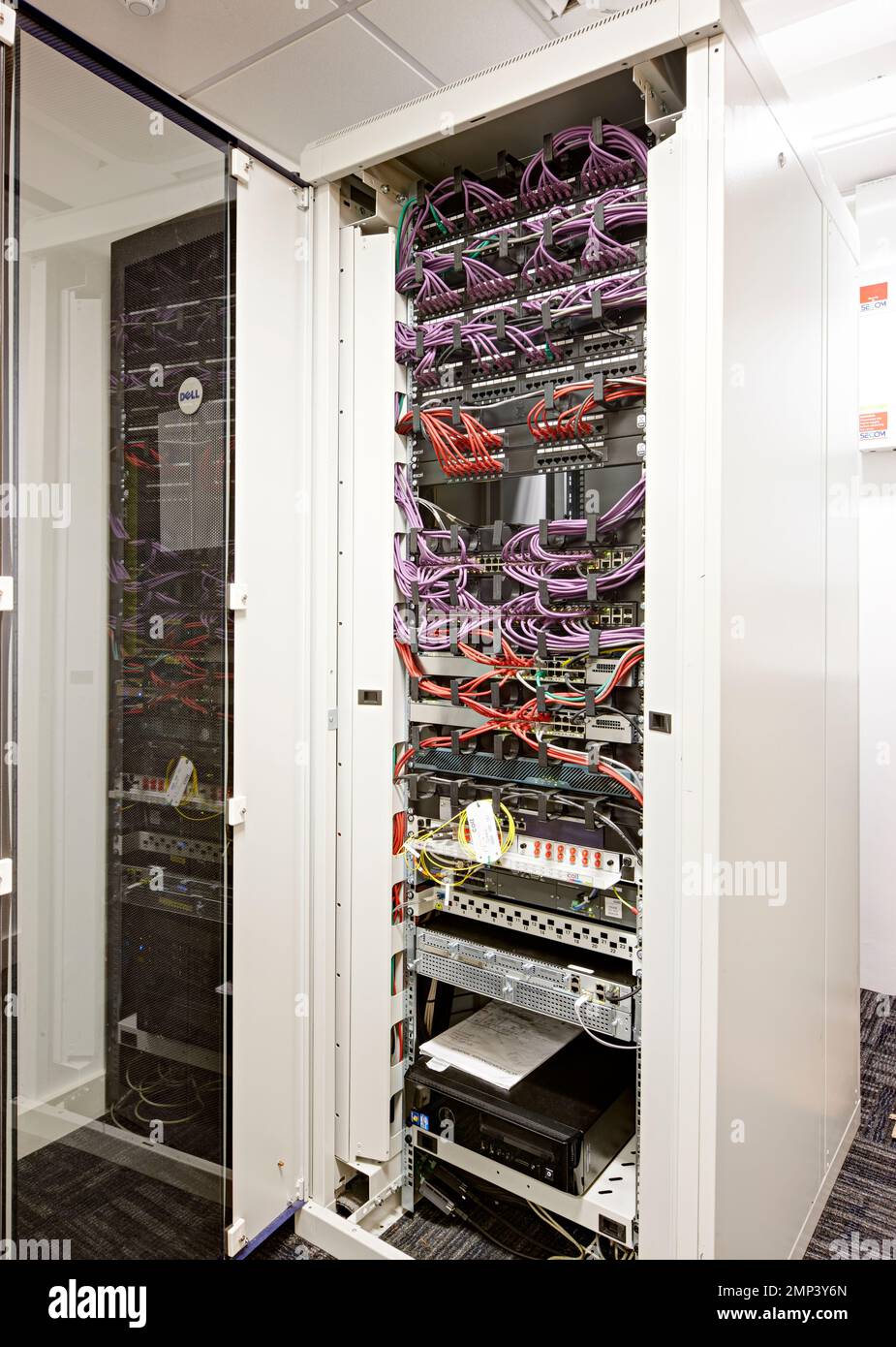 server networking rack communication internet fibre data centre small company cupboard backup network cloud security Stock Photo