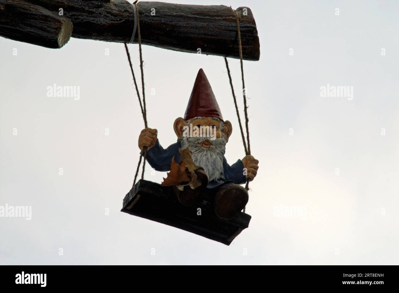 Dwarf on a swing Stock Photo