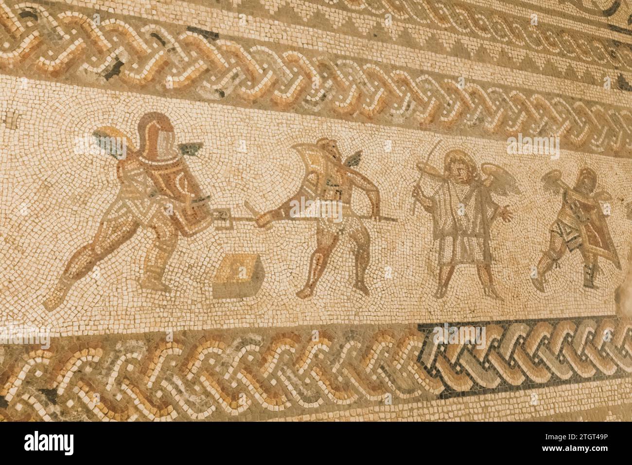 England, West Sussex, Bignor Roman Villa, Roman Mosaic depicting Gladiators Stock Photo