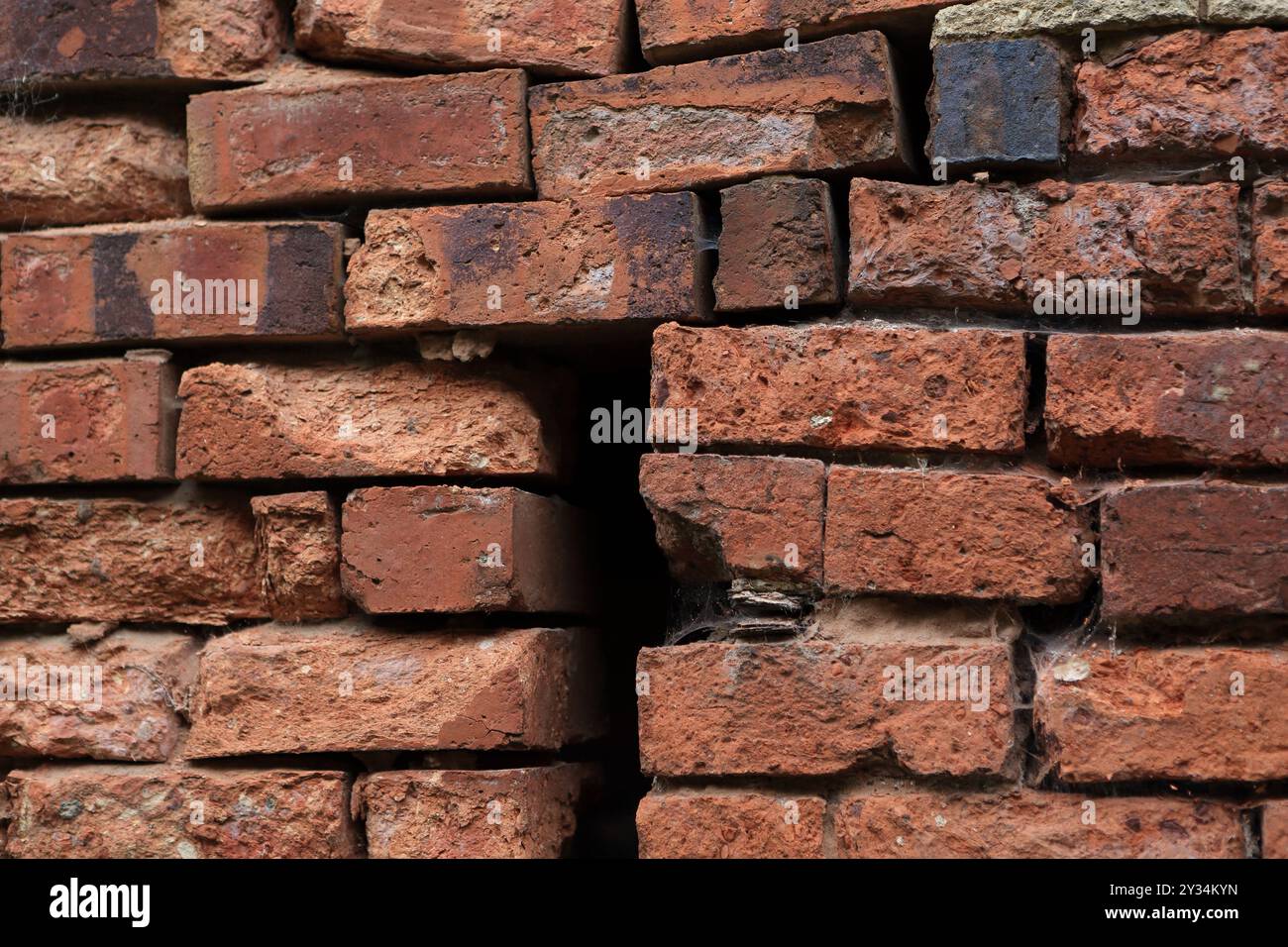 Brick wall construction gaps in brickwork uneven brickwork bad workmanship Stock Photo