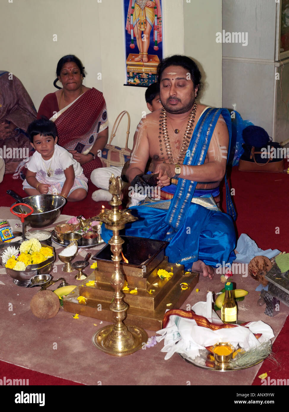 Murugan Temple New Malden Surrey England Priest During Ceremony with Sacred Fire Stock Photo