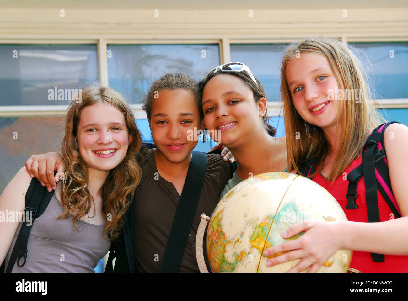 Portrait of a group of young smiling school girls Stock Photo