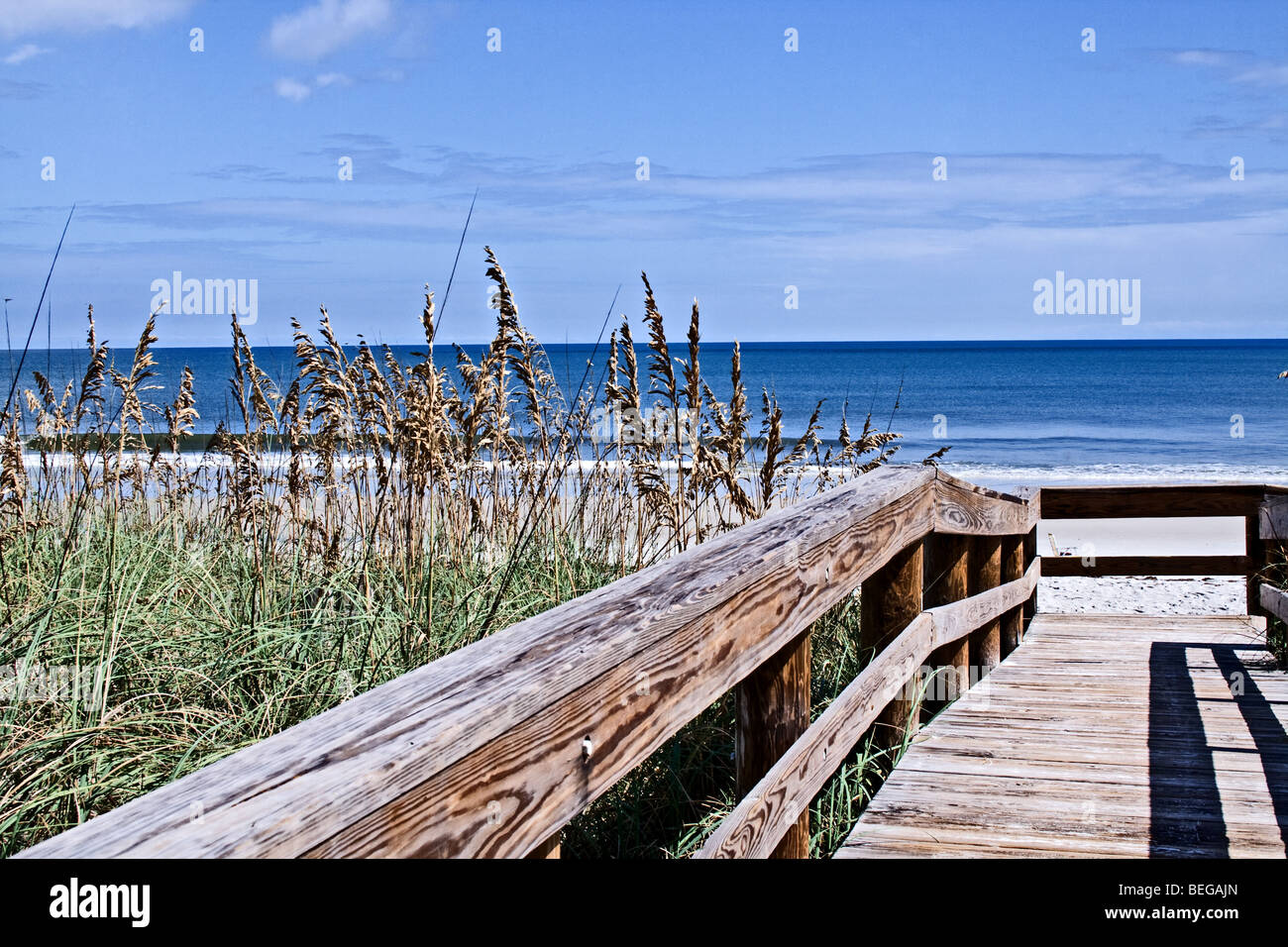 Elevated wooden walkway down to the Atlantic Ocean in Florida Stock Photo