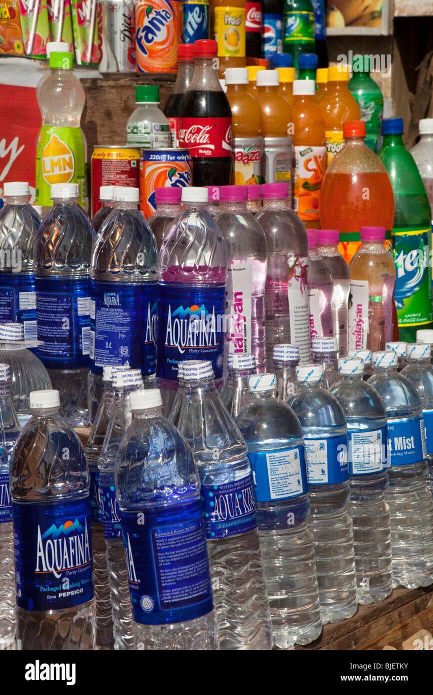 India, Kerala, Varkala, tourist shop selling bottled drinking water and soft drinks in plastic bottles Stock Photo