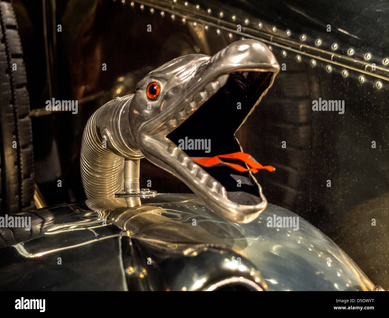 Horn in the shape of a boa constrictor decorates a 1926 Daimler Model 45 HO Salon Cabriolet luxury car custom built . Stock Photo