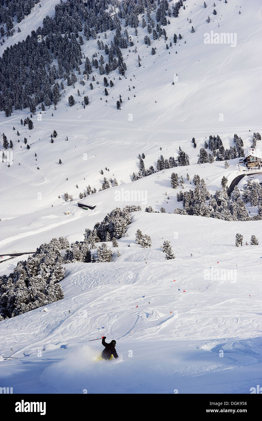 Elevated view of skier going downhill Stock Photo