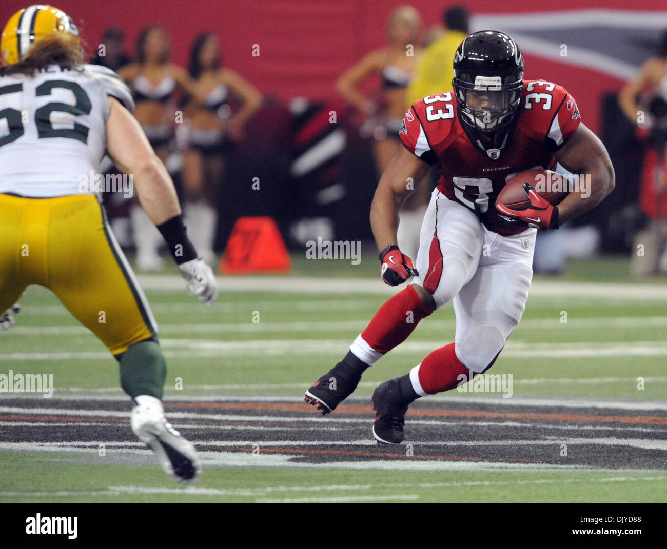 Nov. 28, 2010 - Atlanta, Georgia, U.S. - Atlanta Falcons running back MICHAEL TURNER (#33) dashes past Green Bay Packers linebacker CLAY MATTHEWS (#52) in the first half at the Georgia Dome. (Credit Image: © Erik Lesser/ZUMAPRESS.com) Stock Photo