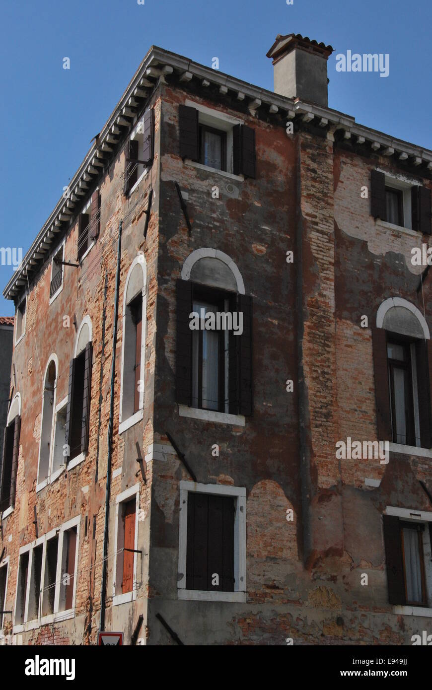 Italy. Venice. ancient building. worn wood, crumbling brickwork. Stock Photo