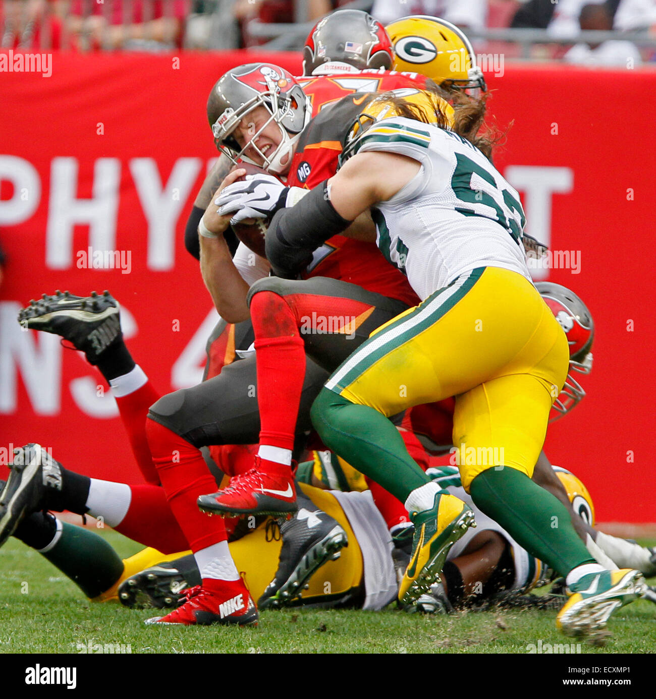 Dec. 21, 2014 - Tampa, Florida, U.S. - Tampa Bay Buccaneers quarterback JOSH MCCOWN is sacked by Green Bay Packers linebacker CLAY MATTHEWS (52) in the 4th quarter at Raymond James Stadium. (Credit Image: © Jim Damaske/Tampa Bay Times/ZUMA Wire) Stock Photo