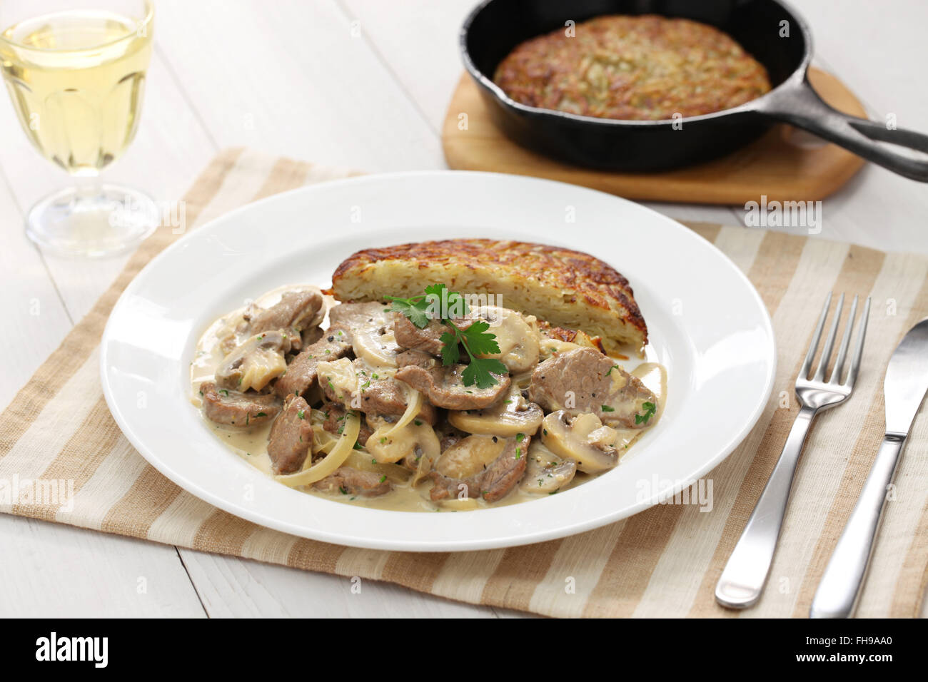 Zurich style veal stew and rosti potato, Swiss cuisine Stock Photo