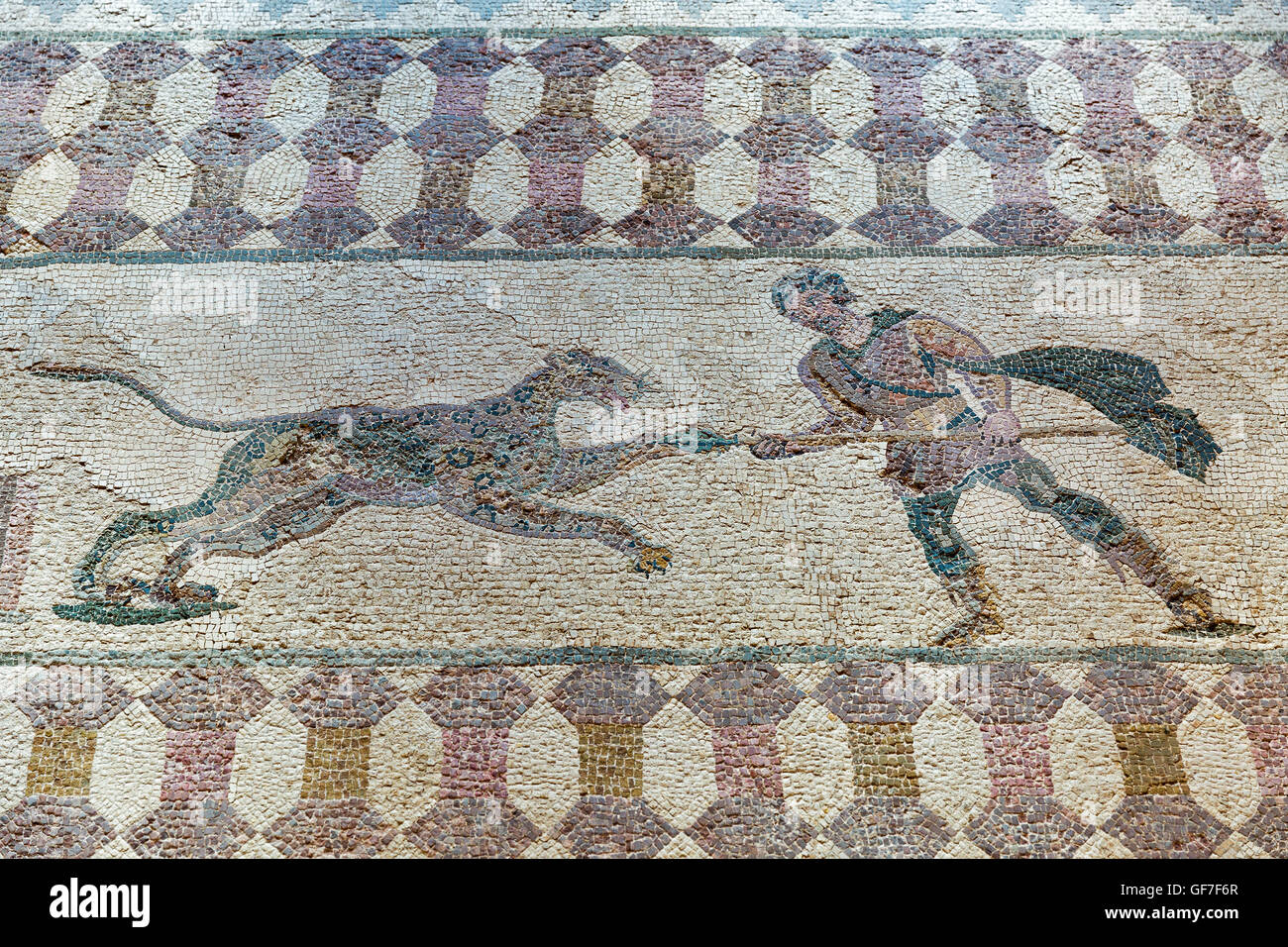 Ancient Greek floor mosaic in archaeologic park Kato Paphos, Cyprus. UNESCO World Heritage Site. Stock Photo