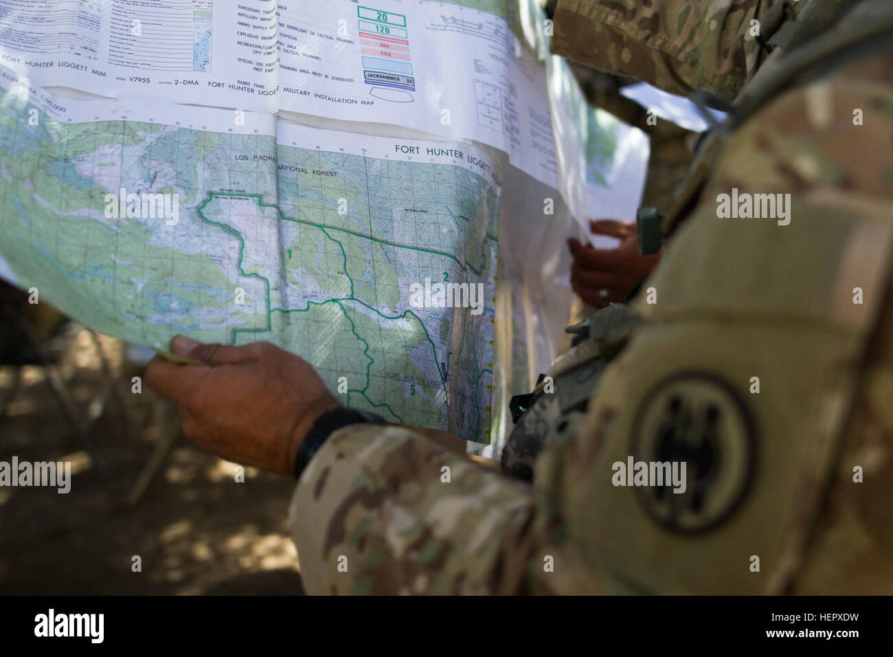 Soldiers from the 341st Military Police Company, of Mountain View, California, use a map to prepare for a simulated mission during the Combat Support Training Exercise (CSTX) at Fort Hunter-Liggett, California, on 18 June. 54 units from across the U.S. Army Reserve, National Guard, Active Army, U.S. Air Force, U.S. Navy, and Canadian Army participate in the 84th CSTX of the year, CSTX 91-16-02, hosted by the 91st Training Division. (Photos by Spc. Victoria Friend) Military Police Army Reserve Soldiers train at Fort Hunter Liggett 160618-A-SB647-142 Stock Photo